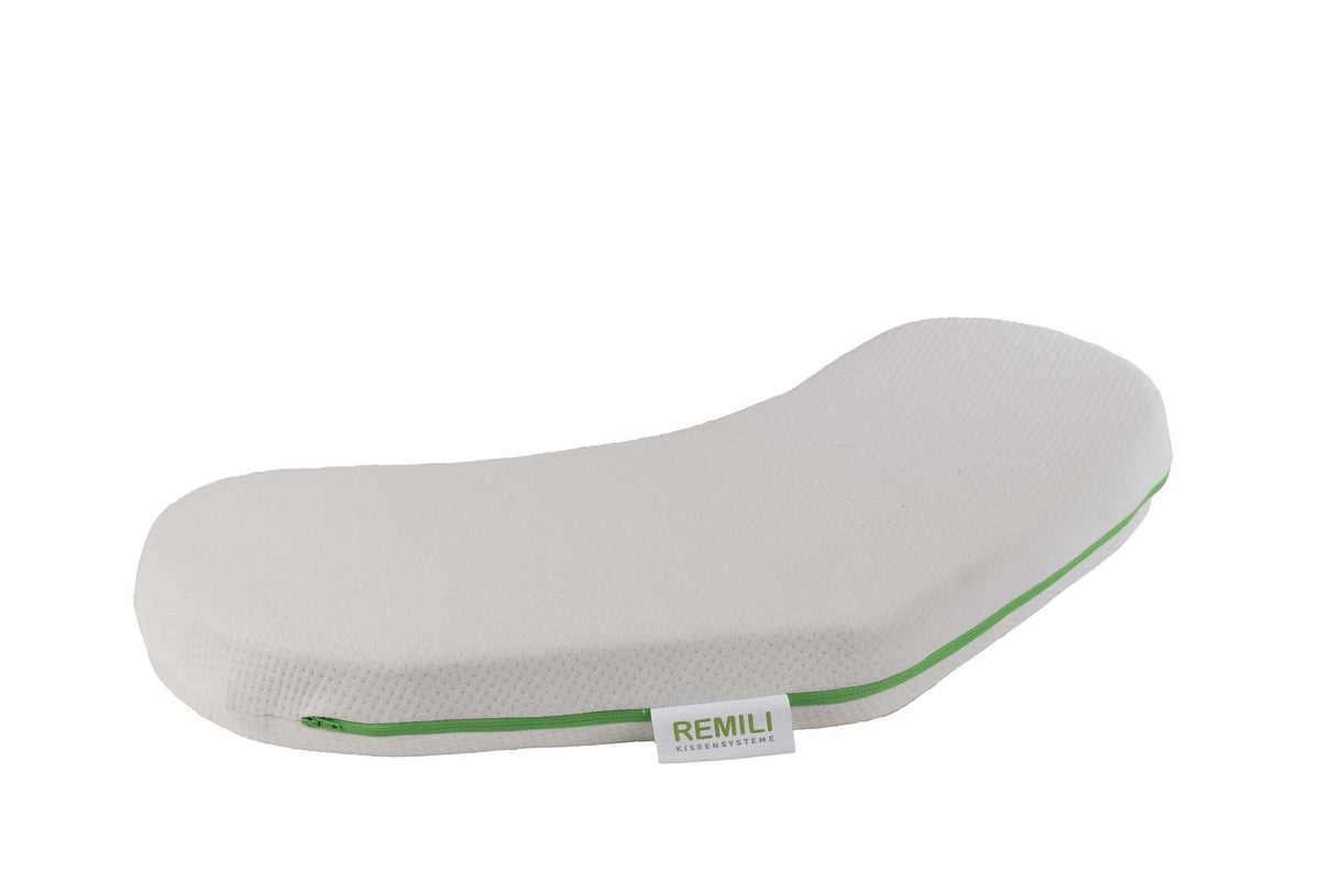 Weißes ergonomisches Kissen im Seitenprofil auf hellem Hintergrund